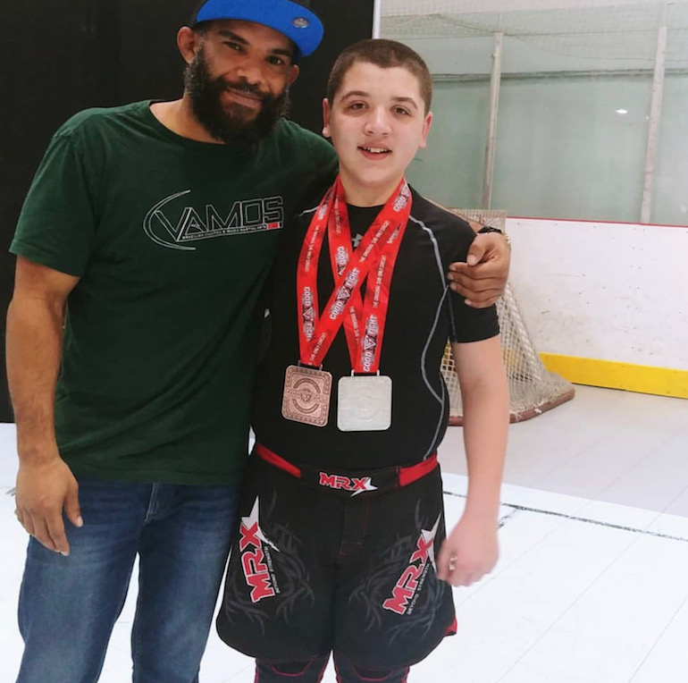 Ian Hill with one of his star students