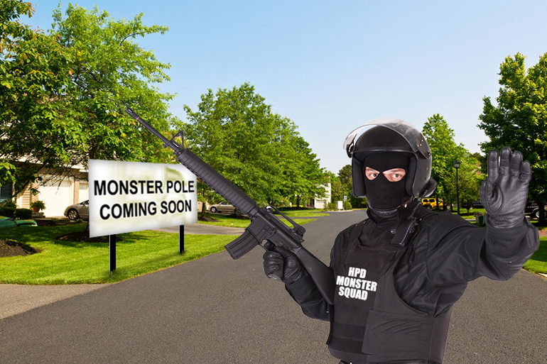 Hamptons Police in riot gear prepare for the Monster Pole on quiet suburban street