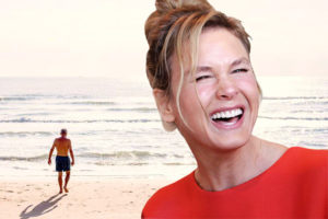 Renée Zellweger laughing and Commissioner Aspinall on beach vacation