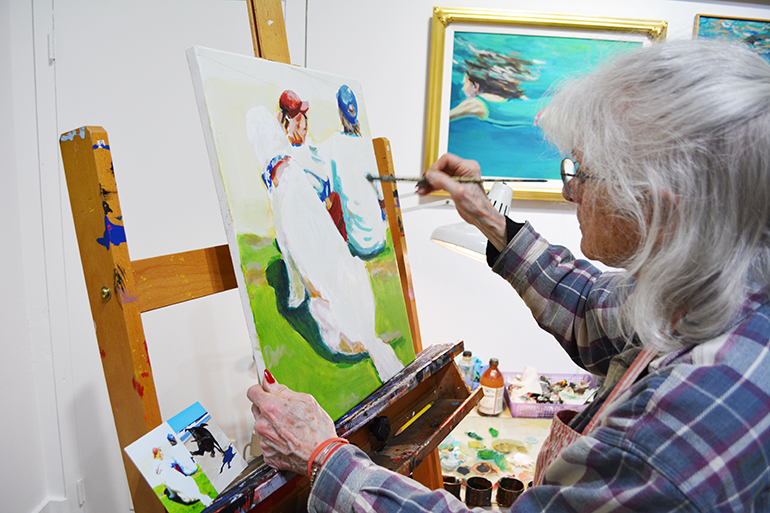 Dinah Maxwell Smith working on a painting