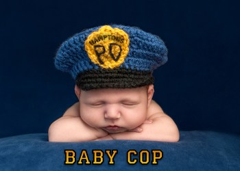 Newborn Baby Boy Wearing a Police Hat