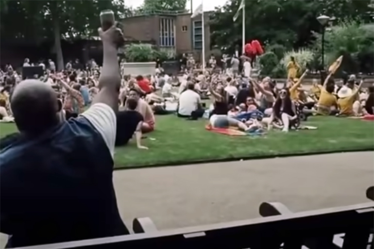 Man on park bench sings Bon Jovi's "Livin' On A Prayer" and everyone in the park joins him