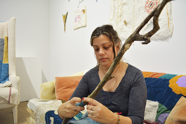 Erica-Lynn Huberty working on a new mixed media piece