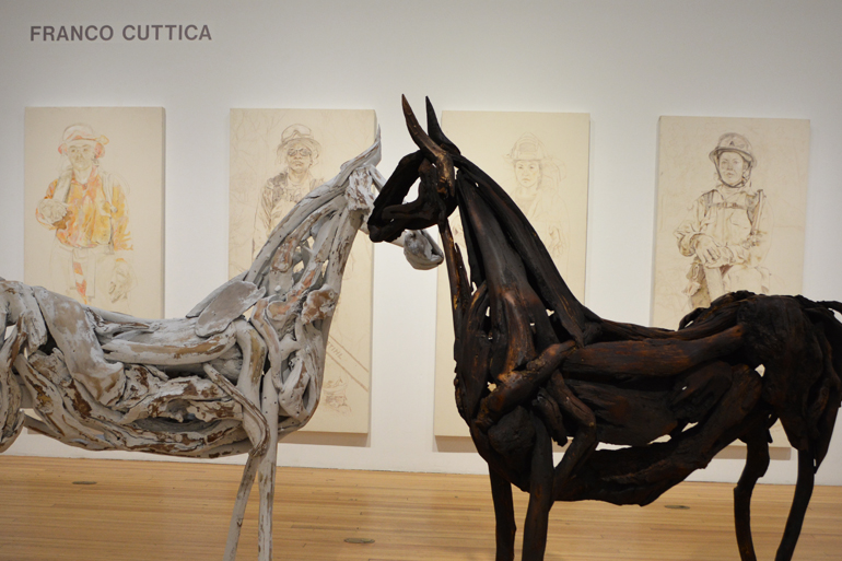Franco Cuttica's driftwood horses in front of his female firefighter series