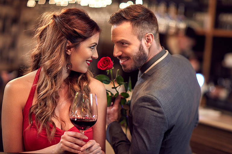 Man give rose to girlfriend in the Valentine’s evening