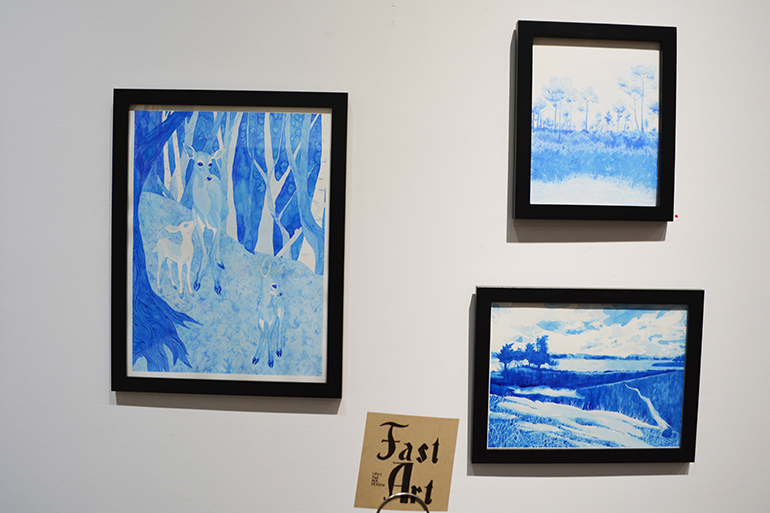 Several of Jodi Bentivegna's blue works on display