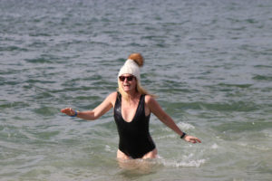 A Frosty Plunge participant returning from the icy water