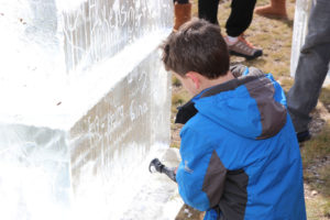 Logan age 8 writing on the ice graffiti wall