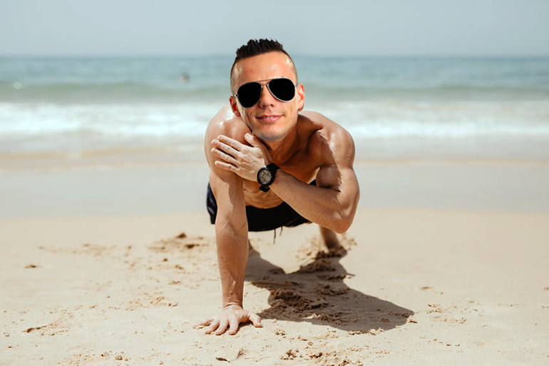 Rex Gallant enjoys one-arm pushups training on the beach