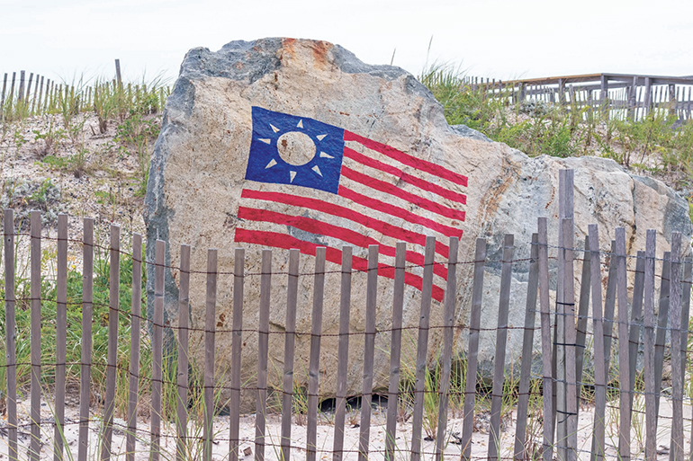 Rock with flag in Hamptons