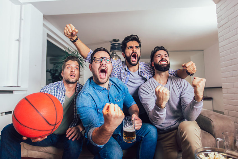 Guys watching basketball