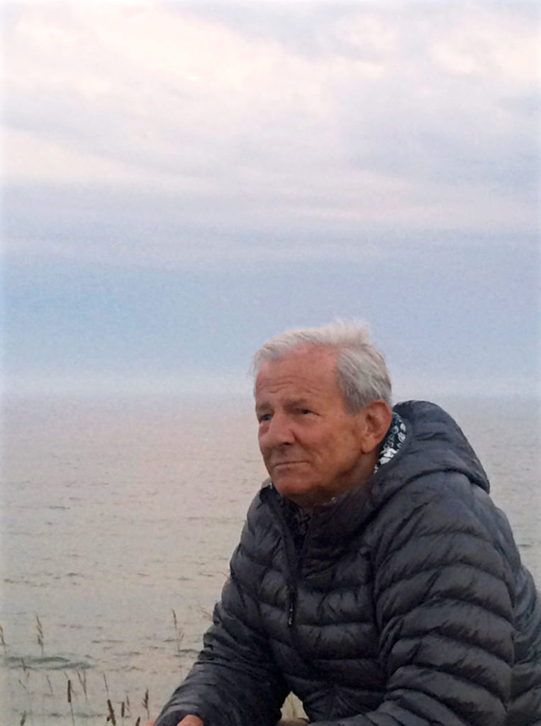Peter Beard in front of ocean in Montauk, 2018
