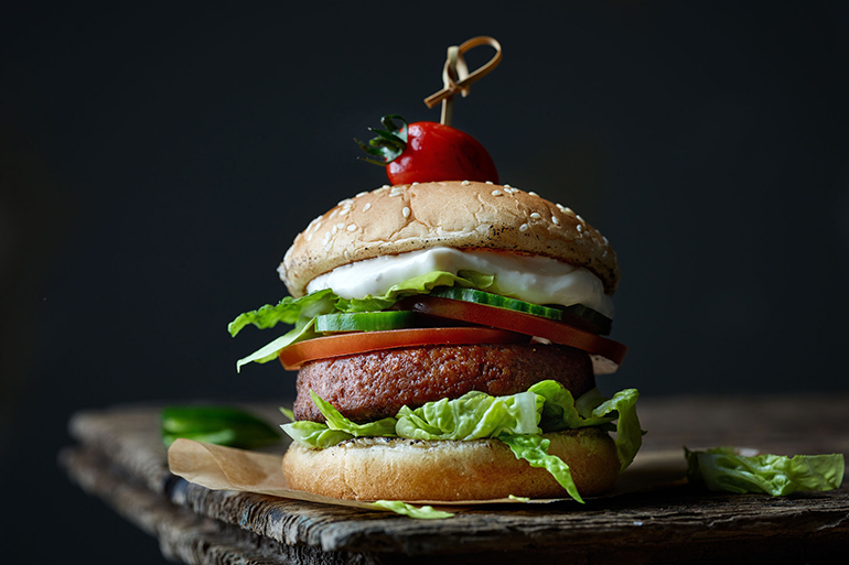 fresh tasty meat free burger on old dark wooden table