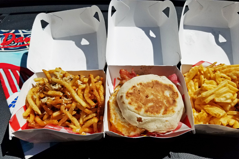 Union Burger Bar's Breakfast Burger with truffle fries and waffle fries, delivered with a copy of Dan's Papers, Photo: David Taylor