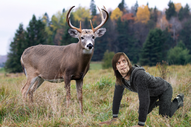 Deer King with his hoofed brethren blurred and desaturated