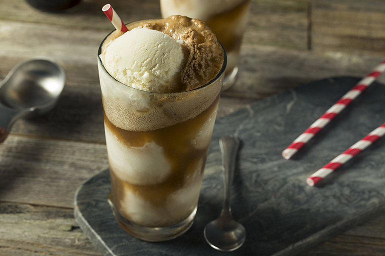 Homemade Soda Black Cow Ice Cream Float with a Straw