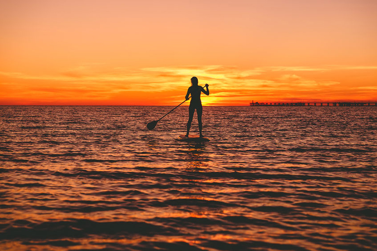 Sunset SUP stand up paddleboarding