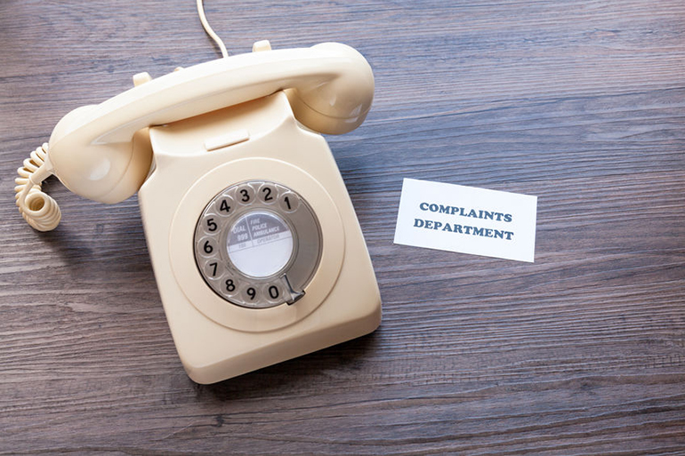 Retro telephone with note - Complaints Department