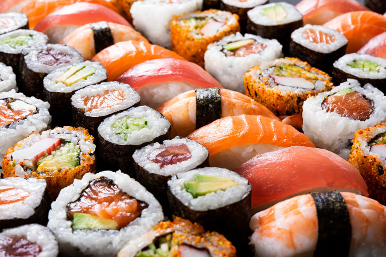 Overhead japanese sushi food. Maki ands rolls with tuna, salmon, shrimp, crab and avocado. Top view of assorted sushi, all you can eat menu. Rainbow sushi roll, uramaki, hosomaki and nigiri.