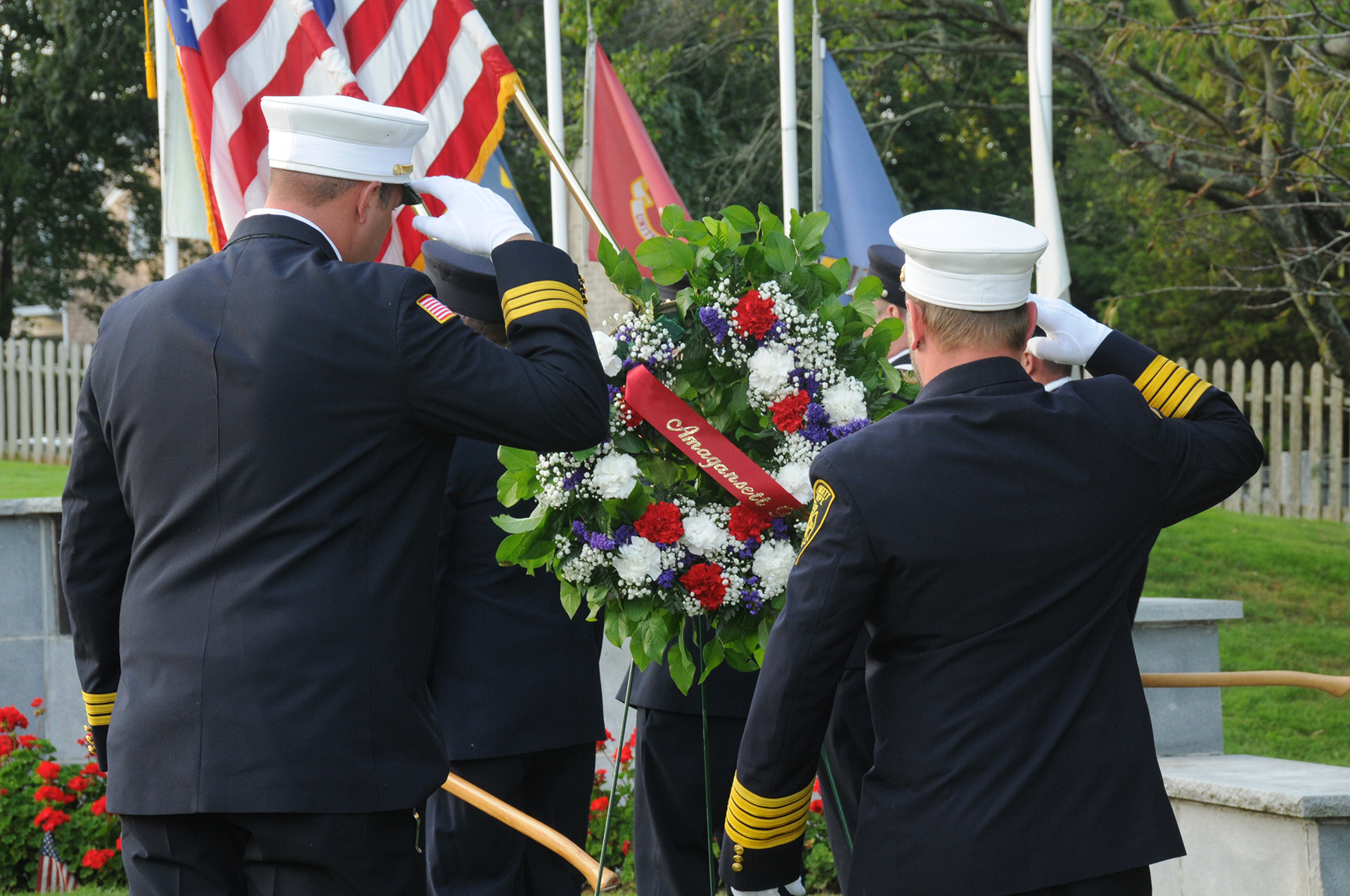 FIRE CHIEFS SALUTE AT THE EAST HAMPTON 9/11 MEMORIAL IN 2019. PHOTO BYRICHARD LEWIN