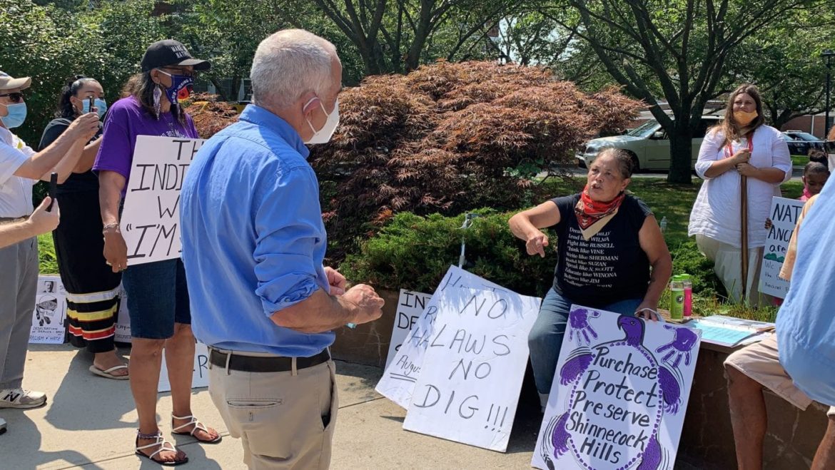 REBECCA GENIA, WHO HAS LONG FOUGHT FOR A GRAVES PROTECTION ACT, WAS AMONG THE PROTESTORS IN FRONT OF SOUTHAMPTON TOWN HALL ON TUESDAY LOOKING FOR ANSWERS FROM SUPERVISOR JAY SCHNEIDERMAN. INDYEASTEND.COM/TAYLOR K. VECSEY