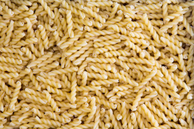 Background texture of dried gemelli pasta