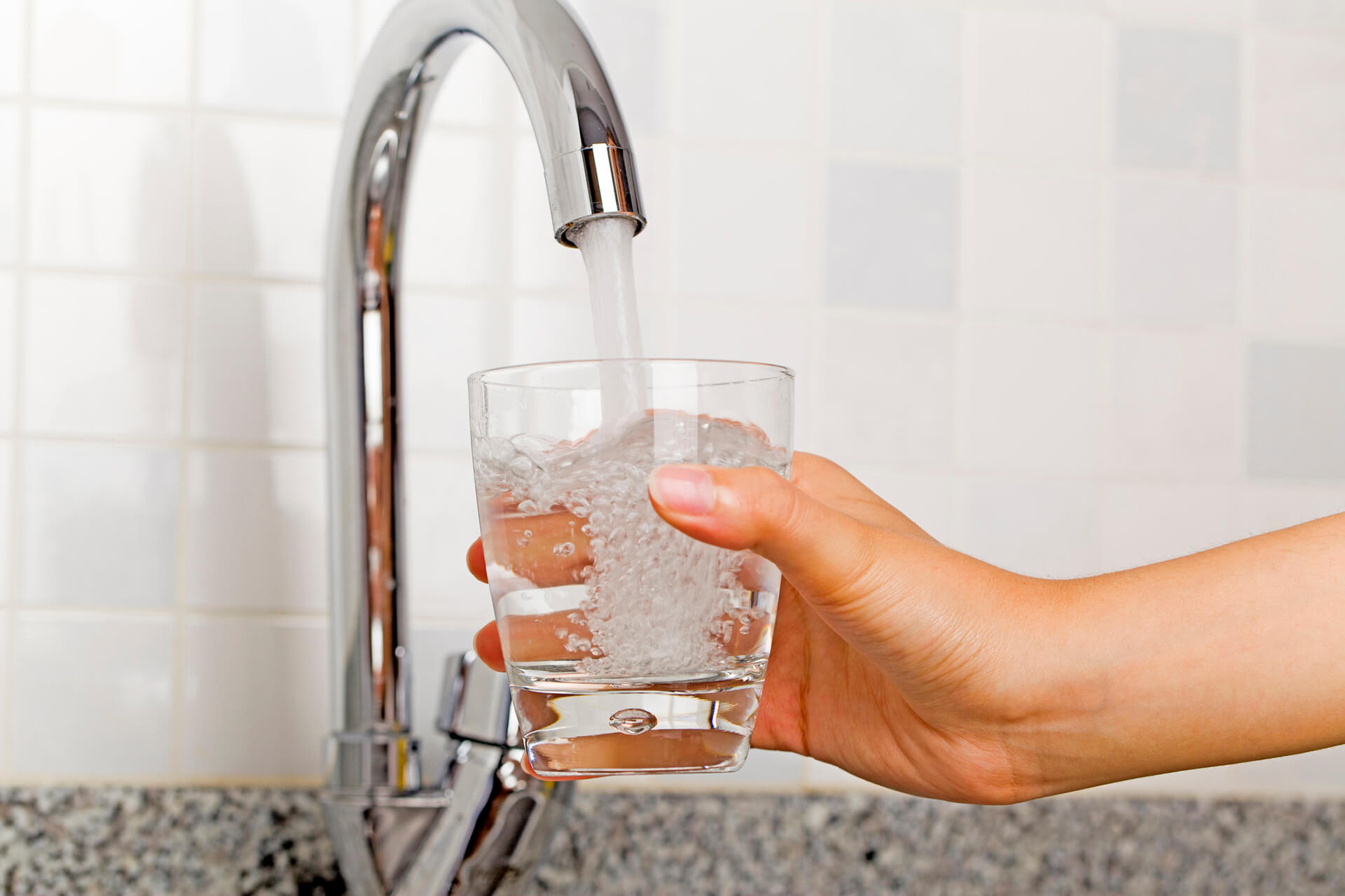 Filling glass of water