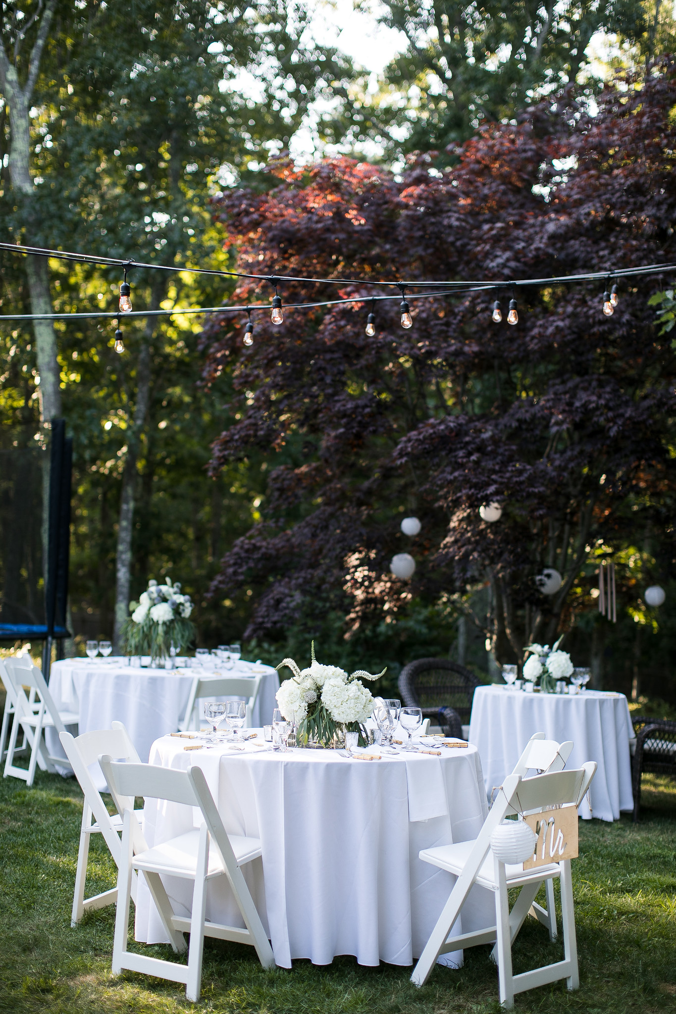 The bride ordered smaller tables from Bermuda Party Rental to help keep guests apart.