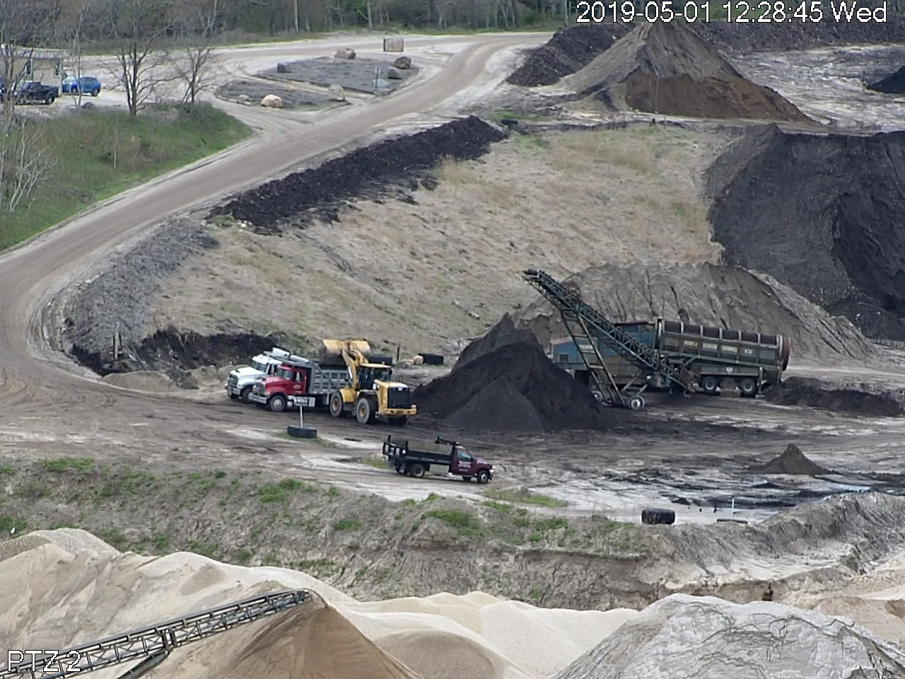 Loading up on mulch from John Tintle’s Sand Land pit, as seen from one of Sam and Keith Christiansen’s surveillance cameras.