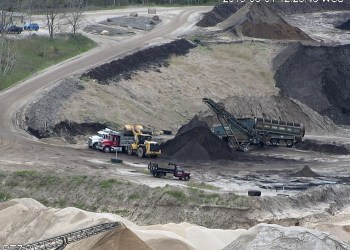 Loading up on mulch from John Tintle’s Sand Land pit, as seen from one of Sam and Keith Christiansen’s surveillance cameras.