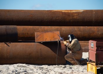 FIMP worker preps pipes during dredging project in the Hamptons