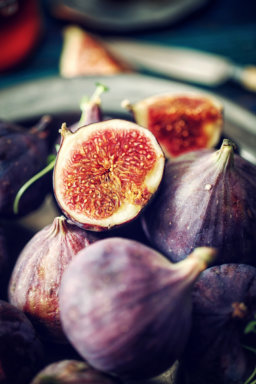 Figs and Sweet Honey on Wooden Background