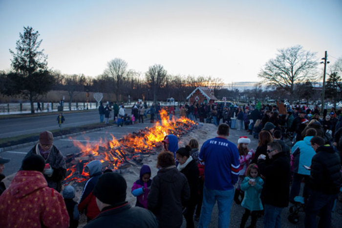 North Fork holiday fun: A scene from Riverhead's annual holiday bonfire on the Peconic River