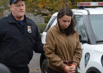 Lisa Rooney brought to East Hampton Justice Court after her pickup truck hit and killed a bicyclist in Montauk, according to police.