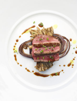 The-1770-House_Chef-Michael-Rozzi_Sliced-New-York-Strip-Steak-with-Roasted-Maitake-Mushrooms-and-Red-Onion-Red-Wine-Reduction-and-Curry-Oil_Photo-Credit-Robyn-Lea-scaled