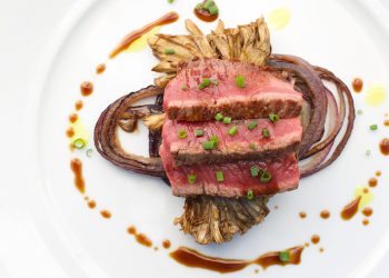 The-1770-House_Chef-Michael-Rozzi_Sliced-New-York-Strip-Steak-with-Roasted-Maitake-Mushrooms-and-Red-Onion-Red-Wine-Reduction-and-Curry-Oil_Photo-Credit-Robyn-Lea-scaled