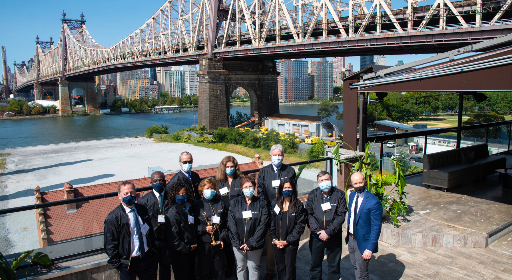 Power Women honorees and their friends and family on the penthouse rooftop of Ravel.