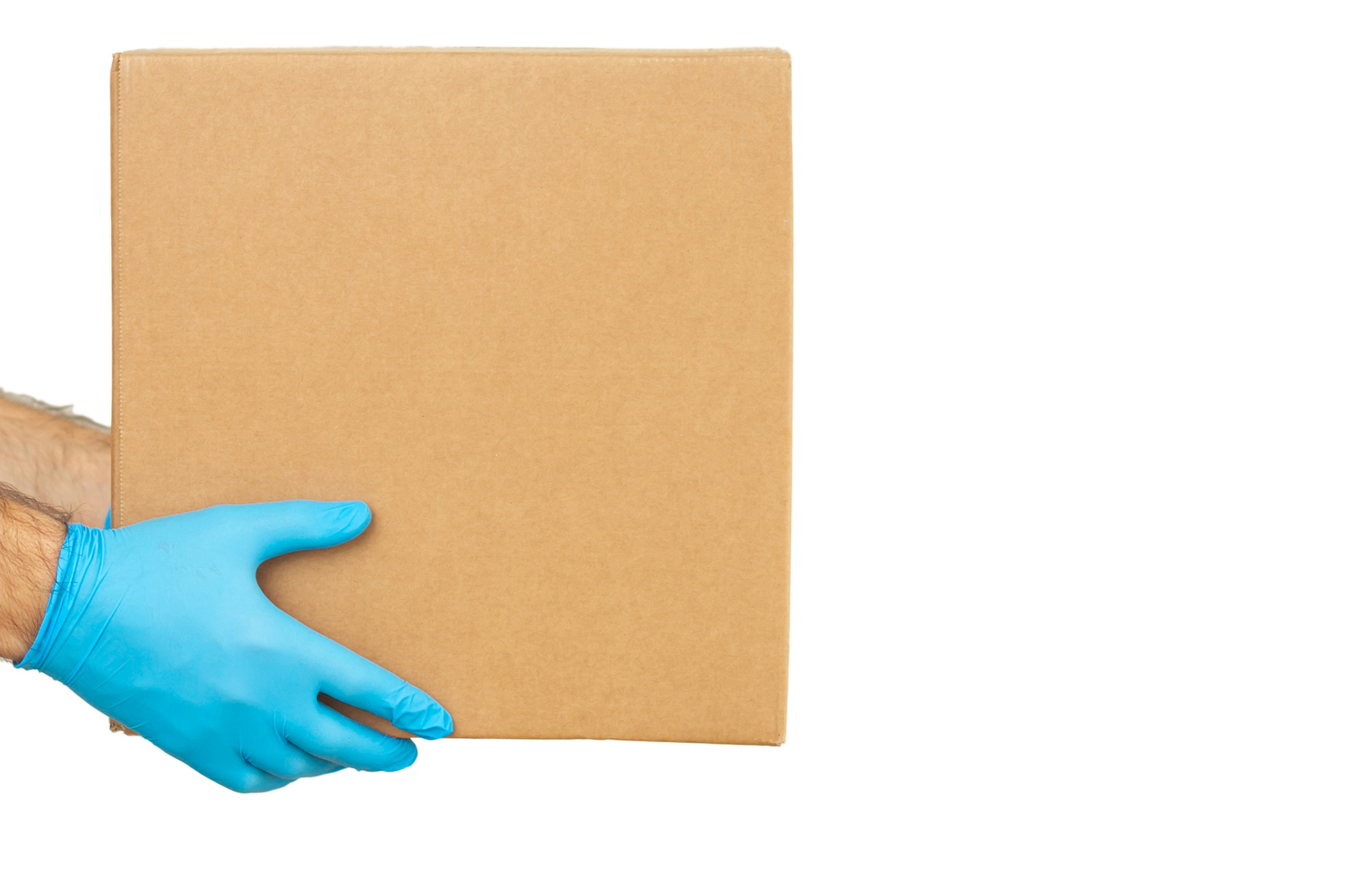 Delivery man holding cardboard boxes / copy space. Delivery by courier in medical rubber gloves. The shipping time during coronavirus