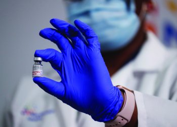 A medical worker displaying a COVID-19 vaccine on January 4, 2021.