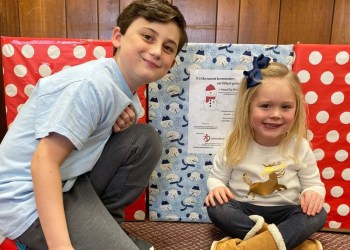 Two CHD warriors, Aidan and Clare, helping to gather and sort toys for the Mended Little Hearts of Long Island Toy Drive.