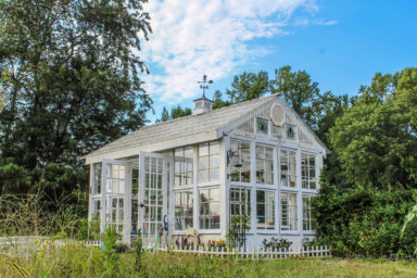 Beautiful Victorian style greenhouse with cupola and weathervane