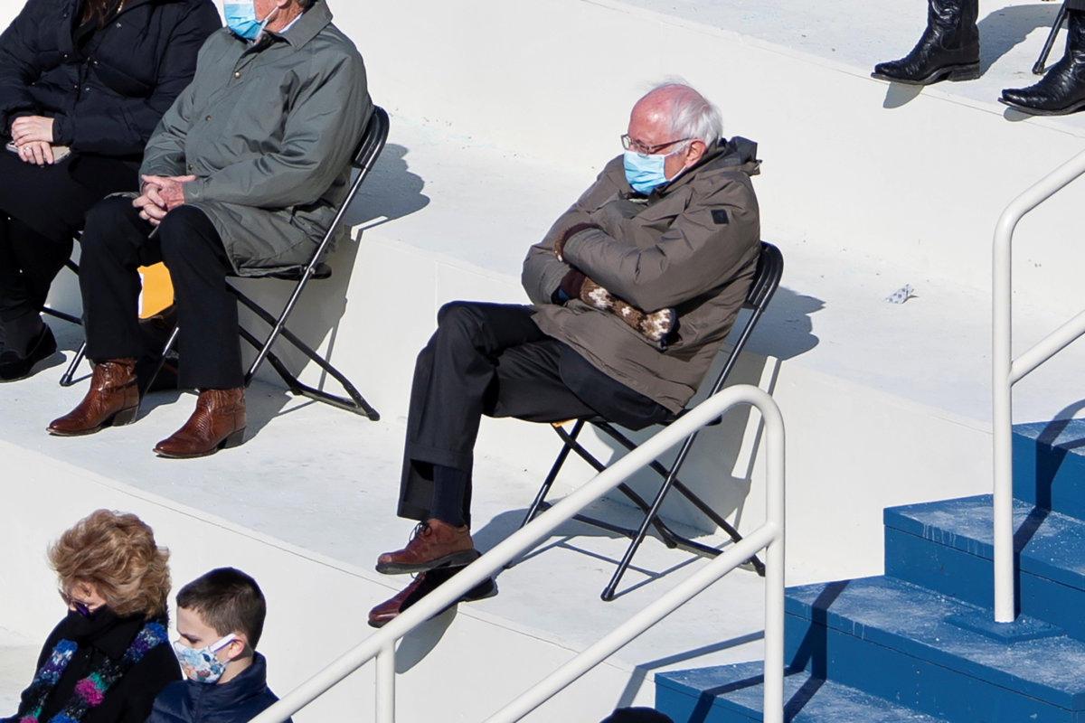 FILE PHOTO: U.S. Senator Bernie Sanders sit socially distanced as he attends the Presidential Inauguration of Joe Biden