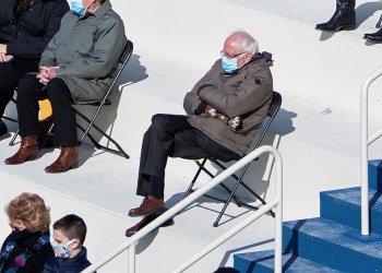FILE PHOTO: U.S. Senator Bernie Sanders sit socially distanced as he attends the Presidential Inauguration of Joe Biden