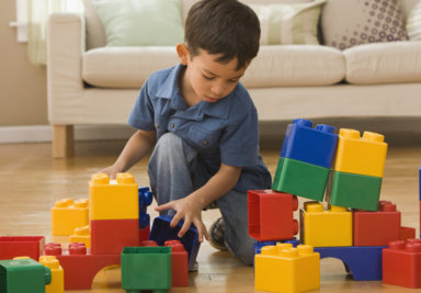 Hispanic boy playing with building blocks
