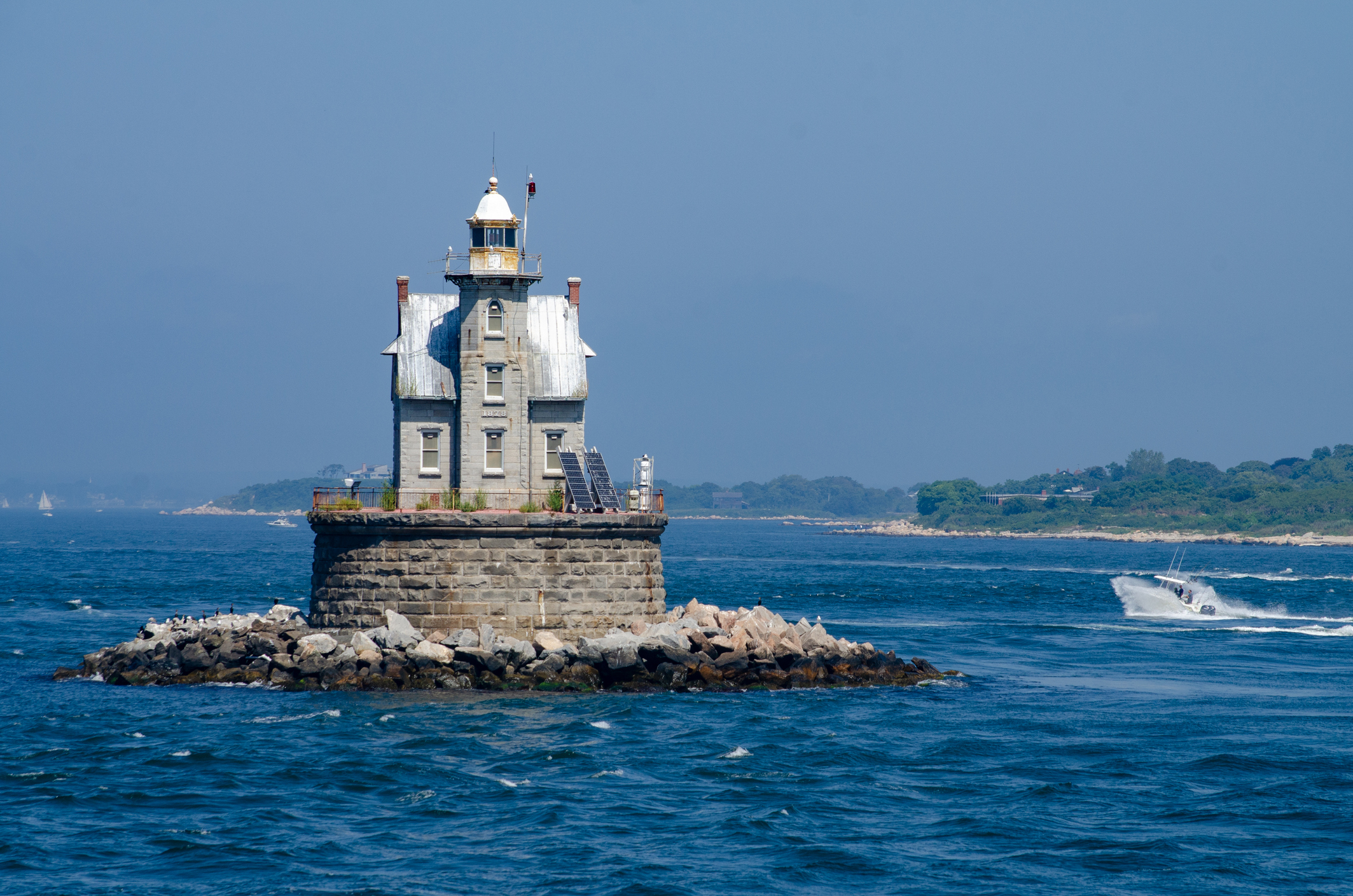 Race Rock Light is a lighthouse on Race Rock Reef, a dangerous set of rocks on Long Island Sound southwest of Fishers Island, New York and the site of many shipwrecks.