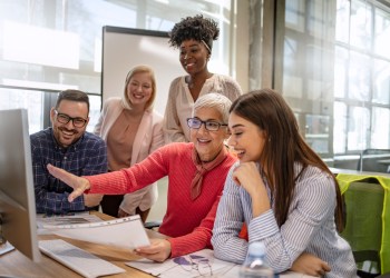 Business people discussing over new business project in office