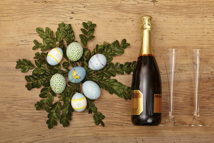 Easter decoration, champagner bootle and champagne glasses on wood