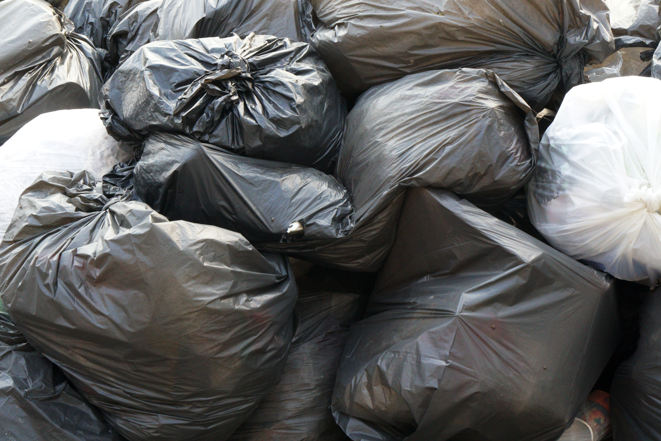 Garbage in the black bag in the waste pile - Not separating waste for Recycle