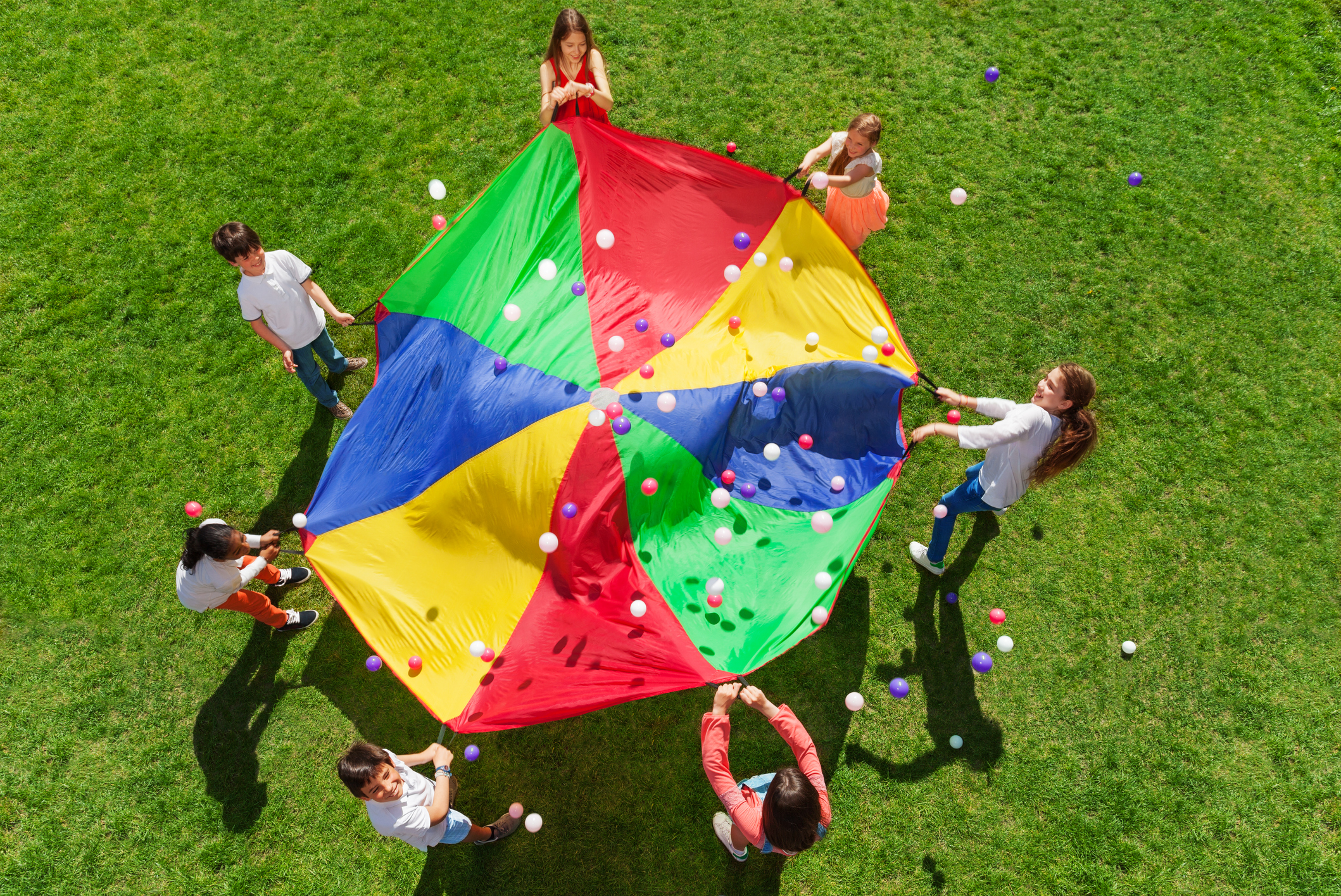 Kids standing in a circle and playing social game