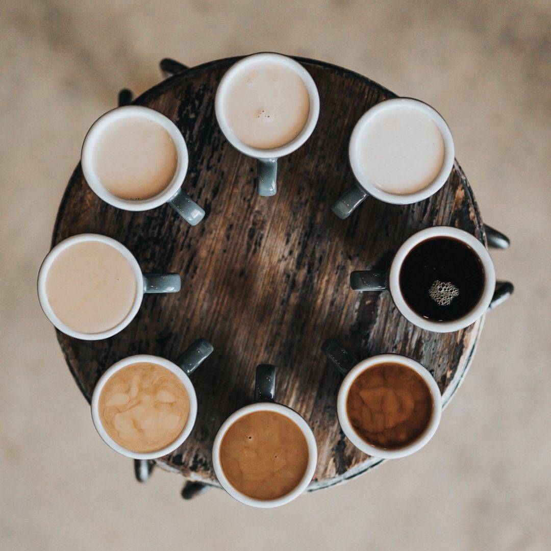 Circle of coffee mugs top view from Caffeine Westhampton